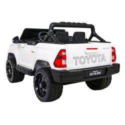 Toyota Hilux na akumulator dla dzieci Biały Pickup + Napęd 4x4 + Pilot + 2 bagażniki